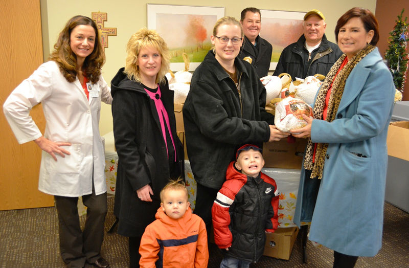 Merrillville Rotary Club Fills Holiday Tables of St. Clare Health Clinic Clients