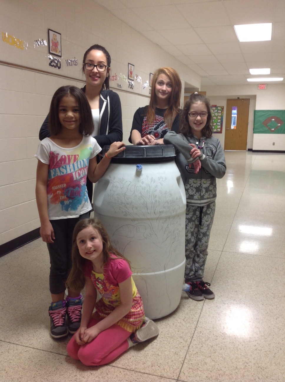 CTE STudents Decorate Rain Barrels for Earth Day Portage.Life